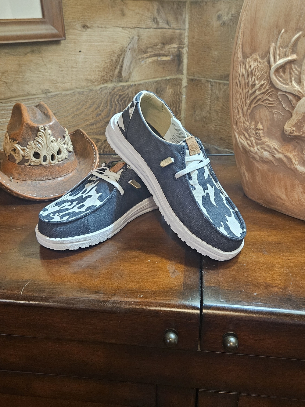 Woman's Casual Canvas Slip-On Shoes in Black and White Cow Print